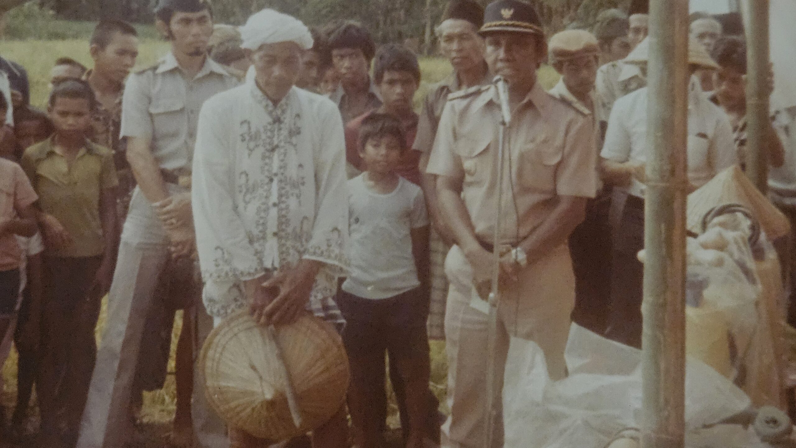 Receiving an award for planting a new strain of rice.